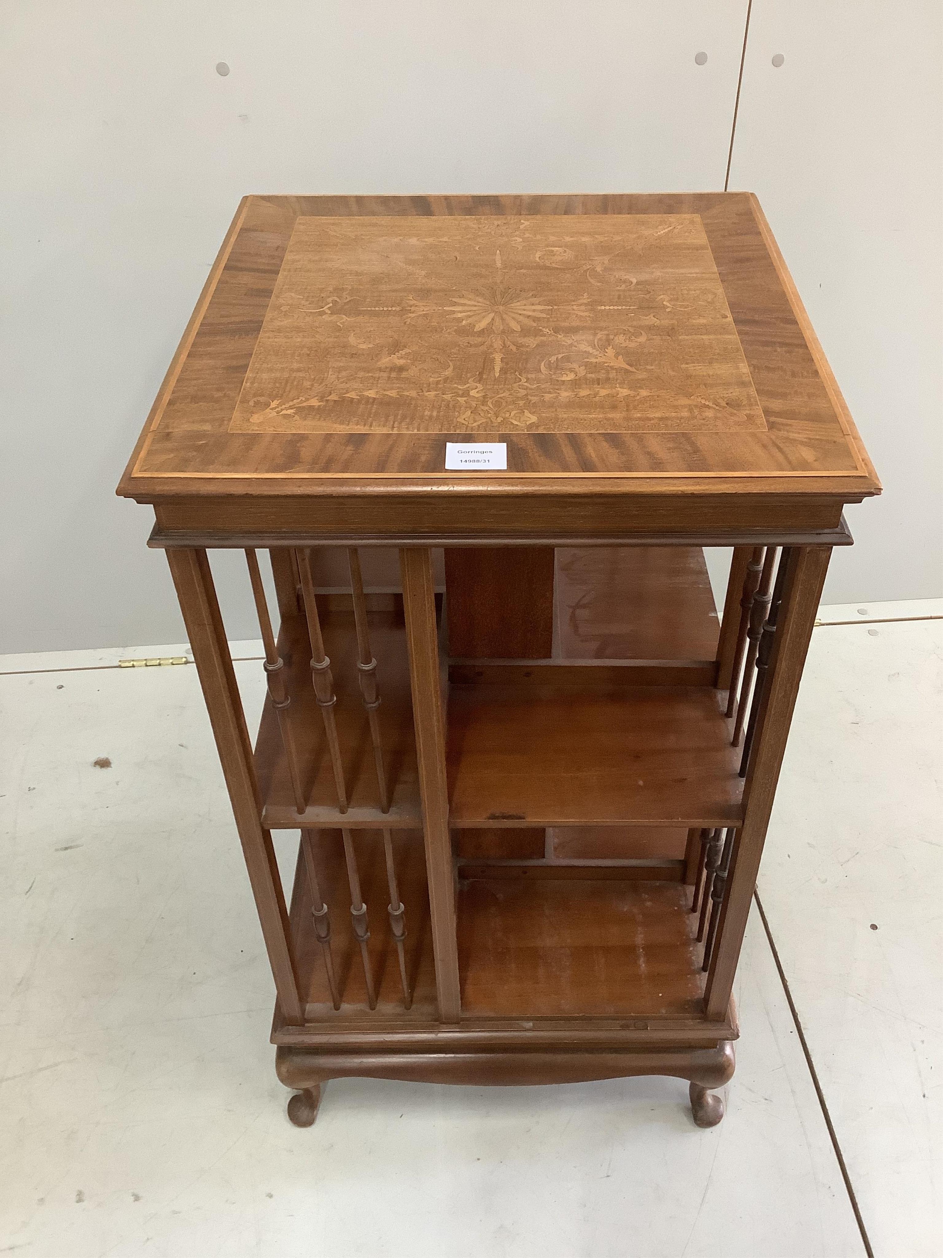 An early 20th century inlaid mahogany square revolving bookcase, 49cm, height 88cm. Condition - fair